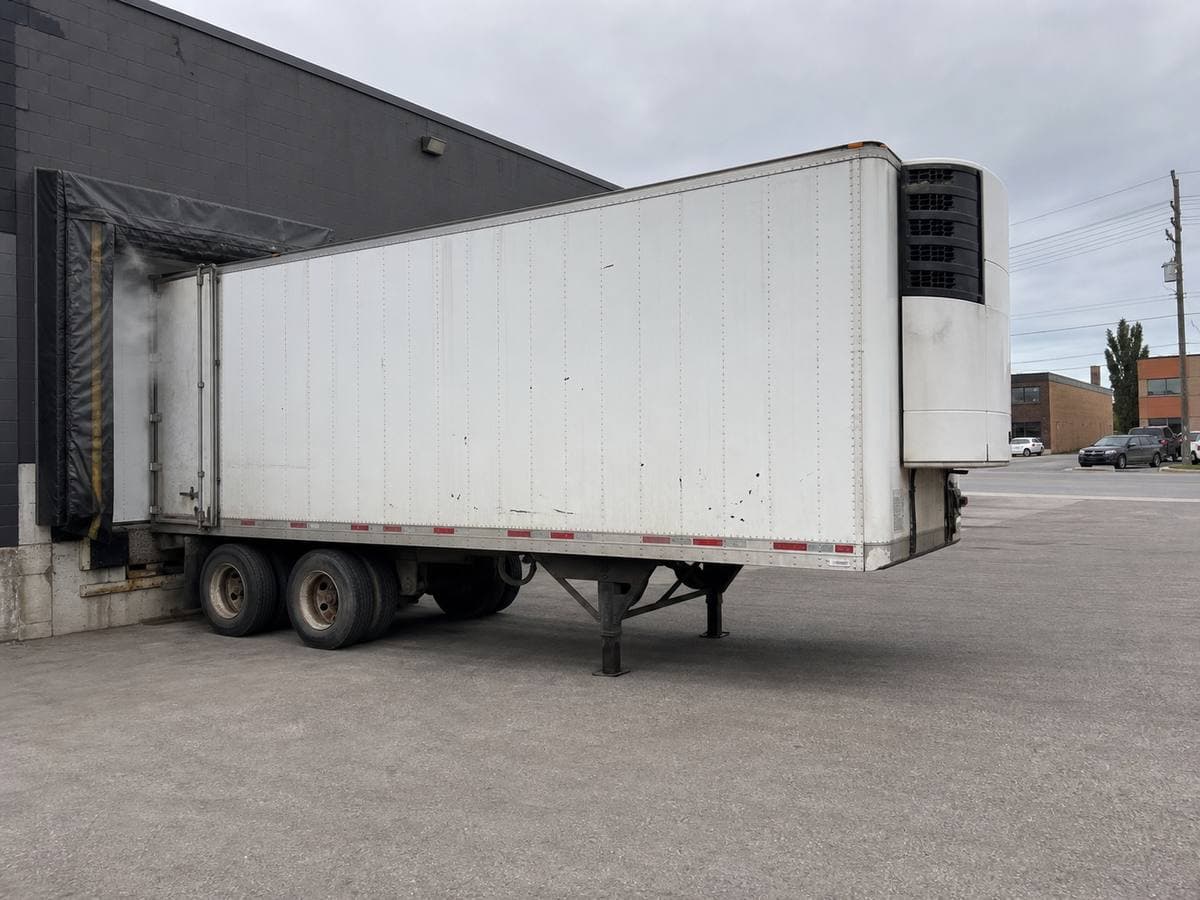 Cold Rescue mobile reefer trailer staged at a commercial loading dock during the day