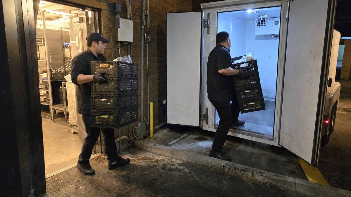 Restaurant inventory being moved into a mobile cold storage trailer